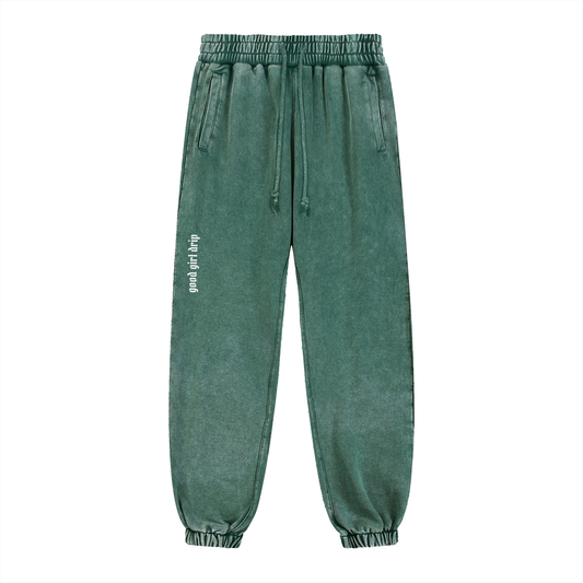 good girl drip snow wash heavyweight joggers in blackish green, front with "good girl drip" thigh print